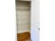 Organized pantry with white wire shelving and laminate flooring for easy storage at 2407 Malster Ln, Lawrenceville, GA 30043