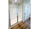 Frameless glass shower with marble-look tile offers a luxurious bathing experience at 2407 Malster Ln, Lawrenceville, GA 30043