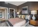 This is a sophisticated bedroom with stylish decor and a glimpse of a closet and en-suite bathroom at 2626 Peachtree Nw Rd # 1108, Atlanta, GA 30305