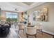 Stylish dining area with views from the balcony, seating four, and decorative mirror at 2626 Peachtree Nw Rd # 1108, Atlanta, GA 30305