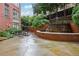 Outdoor patio with a relaxing waterfall feature and seating area at 2626 Peachtree Nw Rd # 1108, Atlanta, GA 30305