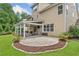 Well-maintained backyard with a paved patio, seating area and landscaped garden at 3260 Caney Creek Ln, Cumming, GA 30041