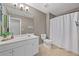 Clean bathroom with white vanity, large mirror, and shower with white curtain at 3260 Caney Creek Ln, Cumming, GA 30041