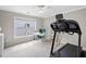 Bedroom with a treadmill machine, providing a dedicated workout space at 3260 Caney Creek Ln, Cumming, GA 30041