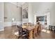 Spacious dining area showcasing hardwood floors, tall ceilings, and views to the stairway at 3260 Caney Creek Ln, Cumming, GA 30041