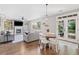 Cozy living room with fireplace, built-in shelves, hardwood floors, and natural light at 3260 Caney Creek Ln, Cumming, GA 30041