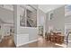 Open-concept living room featuring soaring ceilings, large windows, and hardwood floors at 3260 Caney Creek Ln, Cumming, GA 30041