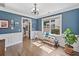 Cozy living area with decorative wainscoting, hardwood floors, and a picturesque window at 3260 Caney Creek Ln, Cumming, GA 30041