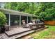 Outdoor wooden deck features comfortable seating and a grill, perfect for outdoor entertaining at 3317 Embry Hills Dr, Atlanta, GA 30341