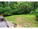 View of the expansive backyard surrounded by mature trees at 3317 Embry Hills Dr, Atlanta, GA 30341