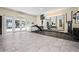 Finished basement featuring a home gym with mirrors, weight-lifting equipment, and tile flooring at 3317 Embry Hills Dr, Atlanta, GA 30341