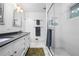 Updated bathroom with double vanity, marble tile floor, and glass shower featuring white subway tile at 3317 Embry Hills Dr, Atlanta, GA 30341