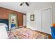 Office space featuring a red brick accent wall and a colorful area rug over hardwood floors at 3317 Embry Hills Dr, Atlanta, GA 30341
