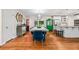 Dining room with hardwood floors, modern lighting, and an open floor plan at 3317 Embry Hills Dr, Atlanta, GA 30341