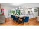 Open floor plan with dining area flowing into kitchen with island and stainless steel appliances at 3317 Embry Hills Dr, Atlanta, GA 30341