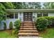 Charming front entrance with stone steps, updated front door, and manicured landscaping at 3317 Embry Hills Dr, Atlanta, GA 30341