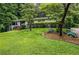 Charming home exterior with a well-manicured lawn and mature trees at 3317 Embry Hills Dr, Atlanta, GA 30341