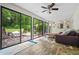 Bright living room with large sliding doors leading to a wooden deck at 3317 Embry Hills Dr, Atlanta, GA 30341