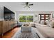 Inviting living room with large windows, hardwood floors, and stylish decor, perfect for relaxation at 3317 Embry Hills Dr, Atlanta, GA 30341