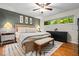 Cozy bedroom with neutral tones, hardwood floors, and natural light at 3317 Embry Hills Dr, Atlanta, GA 30341
