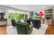 Bright office featuring a large window, stylish decor, and sleek wooden furniture at 3317 Embry Hills Dr, Atlanta, GA 30341
