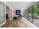 Bright sunroom with many windows, tile floors and sliding doors leading to backyard at 3317 Embry Hills Dr, Atlanta, GA 30341