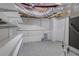Unfinished basement with open ceiling, concrete walls and tile floor, ready for customization at 3758 Lake Haven Way, Atlanta, GA 30349