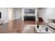 Open basement area featuring a bar with cabinets, hardwood floors, and stairs at 3758 Lake Haven Way, Atlanta, GA 30349