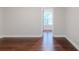 Spacious bedroom featuring gleaming hardwood floors and bright natural light at 3758 Lake Haven Way, Atlanta, GA 30349