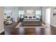 Spacious primary bedroom with wood flooring, two windows, white trim and neutral colors at 3758 Lake Haven Way, Atlanta, GA 30349