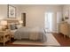 Cozy bedroom features wood floors, a bed, and plenty of natural light at 3758 Lake Haven Way, Atlanta, GA 30349