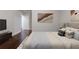 Bright bedroom featuring a comfy bed, stylish art, and a view of the entryway at 3758 Lake Haven Way, Atlanta, GA 30349