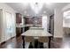 Spacious kitchen featuring dark cabinetry, stainless steel appliances, a large island, and hardwood floors at 3758 Lake Haven Way, Atlanta, GA 30349