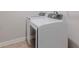 Laundry room featuring a modern, front-loading washer and dryer at 3758 Lake Haven Way, Atlanta, GA 30349