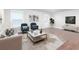 Cozy living room featuring stylish furnishings, a TV, and lots of natural light at 3758 Lake Haven Way, Atlanta, GA 30349