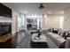 Inviting living space with a fireplace and views into the kitchen, complete with contemporary decor and hardwood floors at 3758 Lake Haven Way, Atlanta, GA 30349