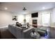 Spacious living area with a fireplace, large windows, hardwood floors, and stylish contemporary furniture at 3758 Lake Haven Way, Atlanta, GA 30349