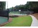 Outdoor basketball court featuring green court and lush surrounding landscape for recreational enjoyment at 5230 Centennial Hill Nw Dr, Acworth, GA 30102