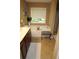 Bright bathroom featuring a soaking tub, neutral tiling, and a vanity sink with cabinets at 5230 Centennial Hill Nw Dr, Acworth, GA 30102