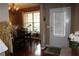 Dining room features wood floors, a chandelier, natural light, and a view of the backyard at 5230 Centennial Hill Nw Dr, Acworth, GA 30102