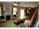 Open concept living area with fireplace, plush seating, and easy access to the kitchen at 5230 Centennial Hill Nw Dr, Acworth, GA 30102
