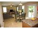 Open-concept living room with dining area, backyard access, neutral colors, and ample natural light at 5230 Centennial Hill Nw Dr, Acworth, GA 30102