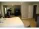 Open and airy primary bedroom featuring a sitting area and private bathroom access at 5230 Centennial Hill Nw Dr, Acworth, GA 30102