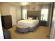 Comfortable main bedroom with a plush bed, accent furniture, and natural light at 5230 Centennial Hill Nw Dr, Acworth, GA 30102