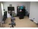 Versatile home office with exercise equipment and ample workspace for productivity at 5230 Centennial Hill Nw Dr, Acworth, GA 30102
