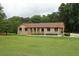 Charming single-story brick home with arched entries and a well-manicured lawn at 5513 N Richland Creek Rd, Buford, GA 30518
