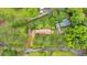 Aerial view showcasing the house, surrounding trees and landscape at 597 Rich Davis Rd, Hiram, GA 30141