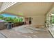 Spacious covered back porch with a grill, perfect for outdoor entertaining and enjoying the serene backyard view at 597 Rich Davis Rd, Hiram, GA 30141