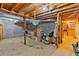Unfinished basement with concrete floor and exposed ceiling at 597 Rich Davis Rd, Hiram, GA 30141