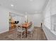 Dining room features hardwood floors, natural light, and is adjacent to the kitchen at 597 Rich Davis Rd, Hiram, GA 30141